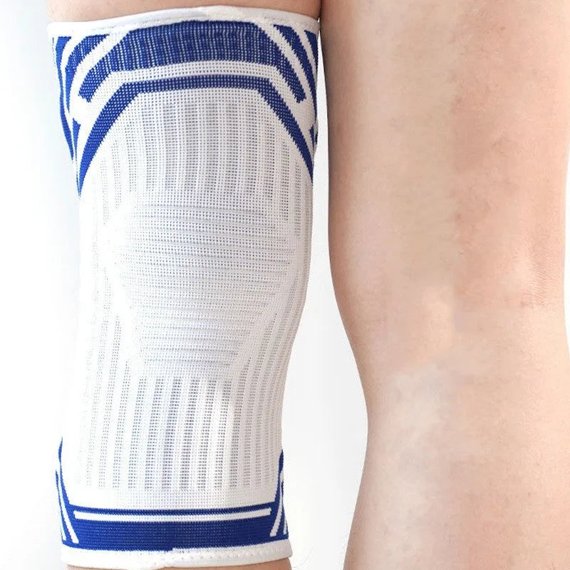 A blue high elasticity cotton knee pad shown on a knee, suitable for basketball and running sports.