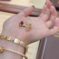 Double-headed geometric ring with irregular cross design in two-tone colours