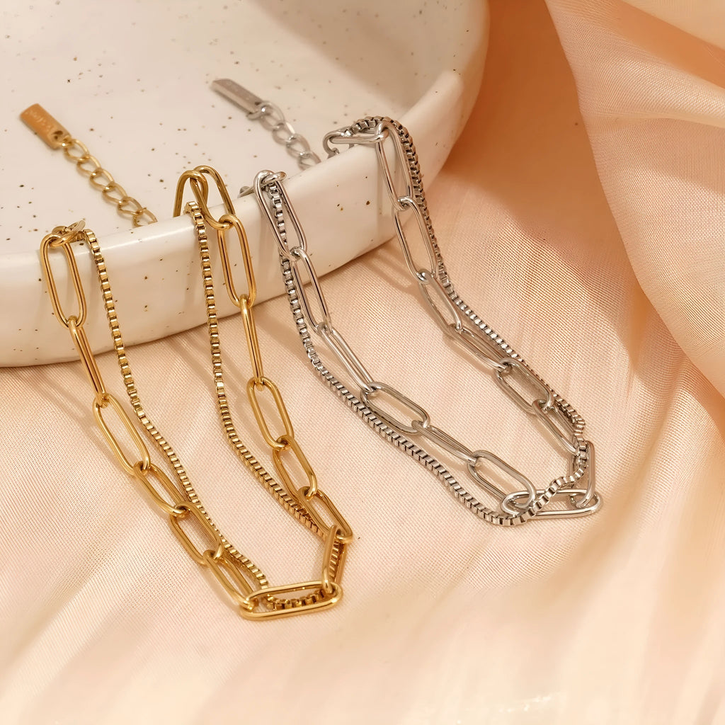 Geometric double layer stainless steel bracelet in gold or silver, showing Ins Cold Style design with linear elements.