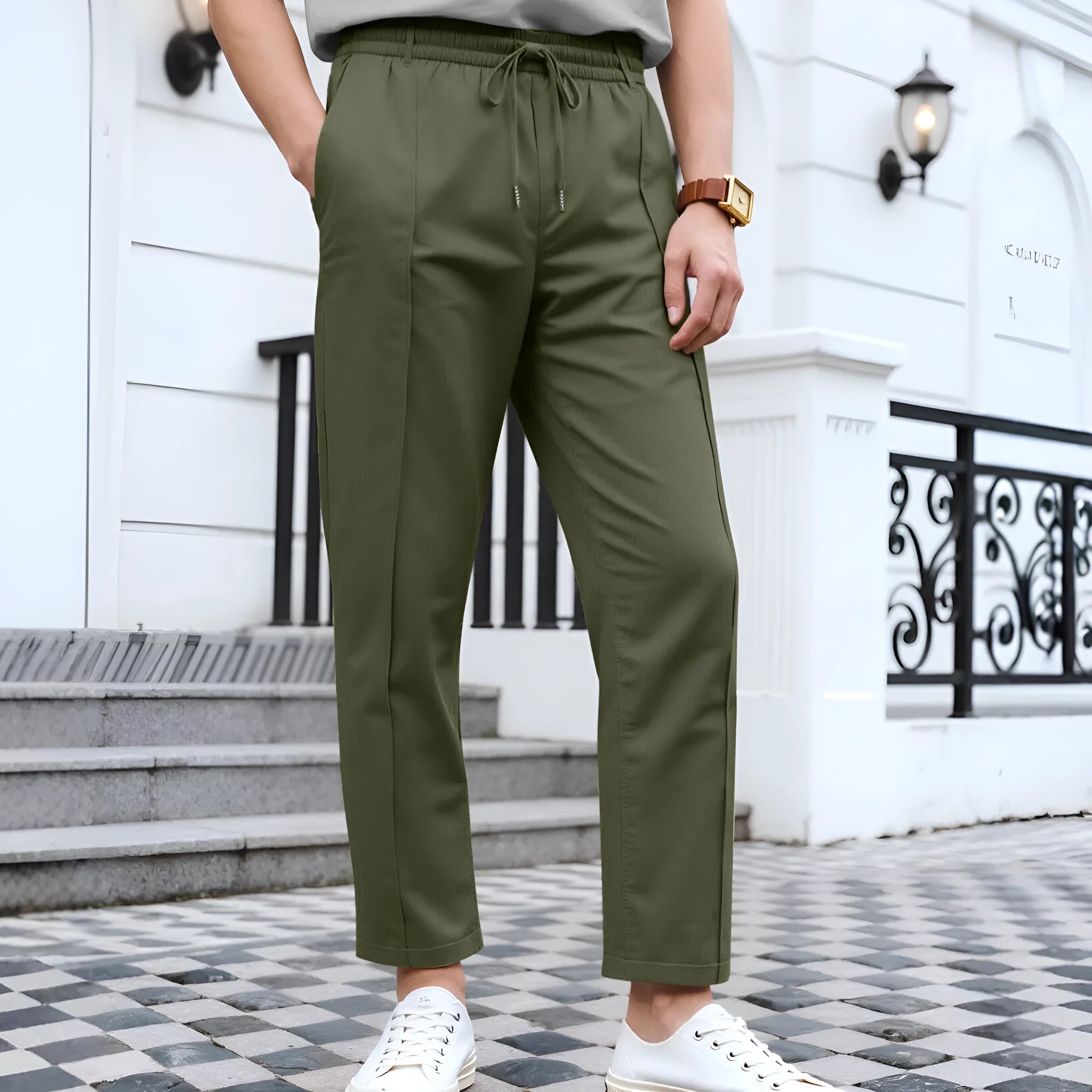 Men's slim fit drawstring trousers in solid colour polyester stretch fabric, front view