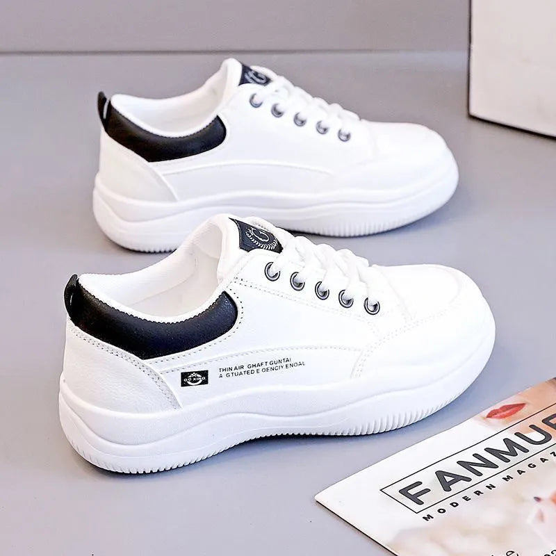 Women's Korean-style white pumps with cross straps and round toe, showing lace-up front and mid-heel