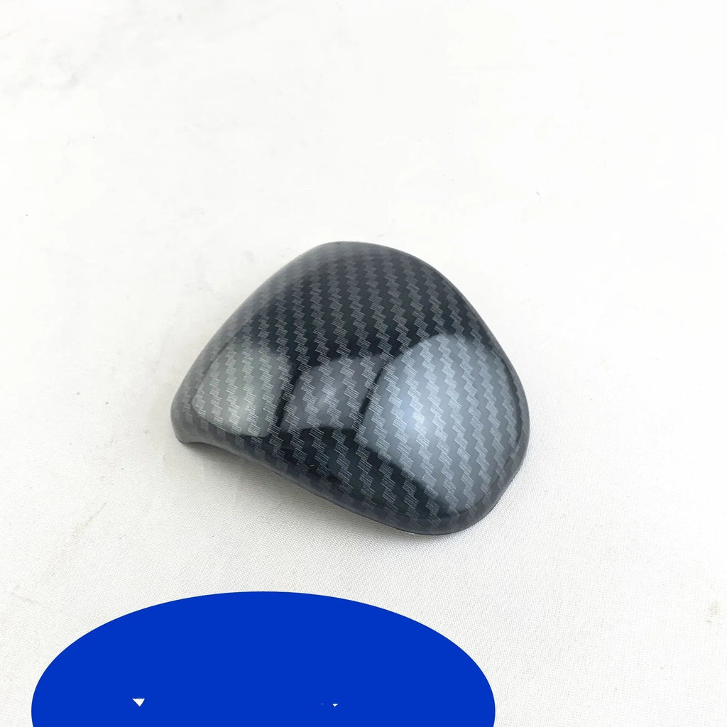 Smart RunK3 gear shift cover in carbon fibre pattern made from black ABS plastic.