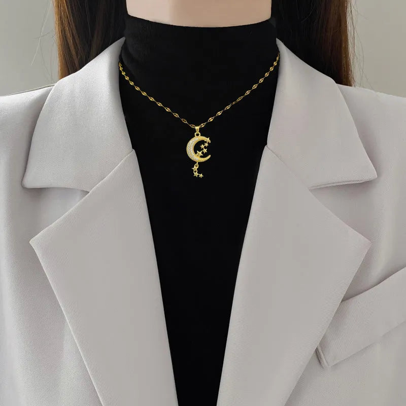 Moon pendant necklace with tassel details on stainless steel chain