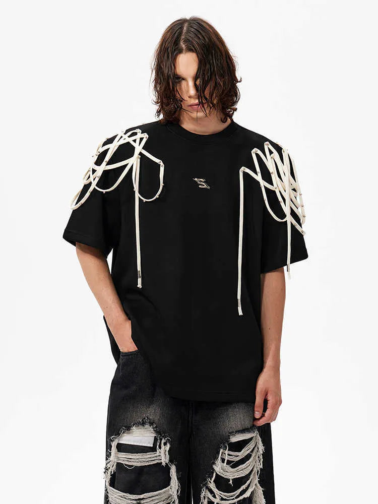 Black short sleeve T-shirt with rivet ribbon padded shoulder detail and loose round neck fit