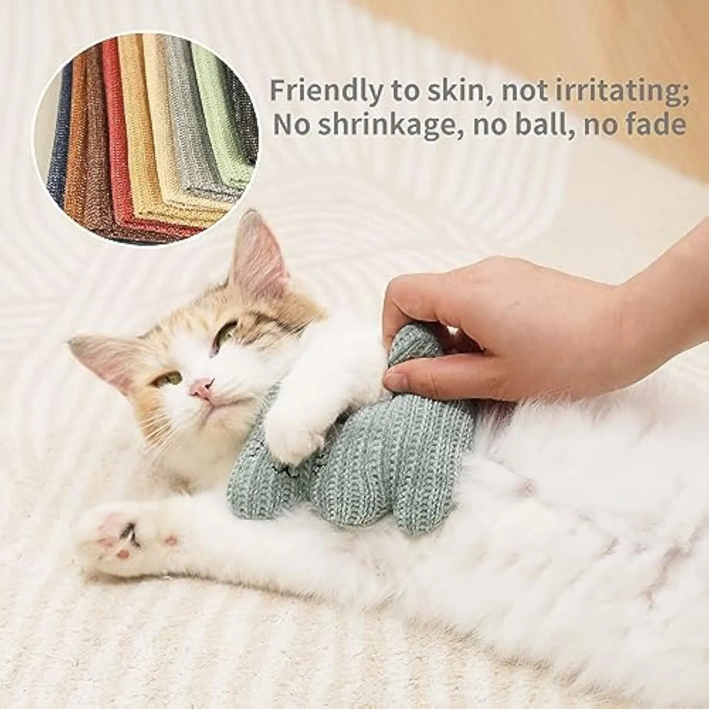 Cyan plush catnip toy with rope elements and a bell for cats on a white background