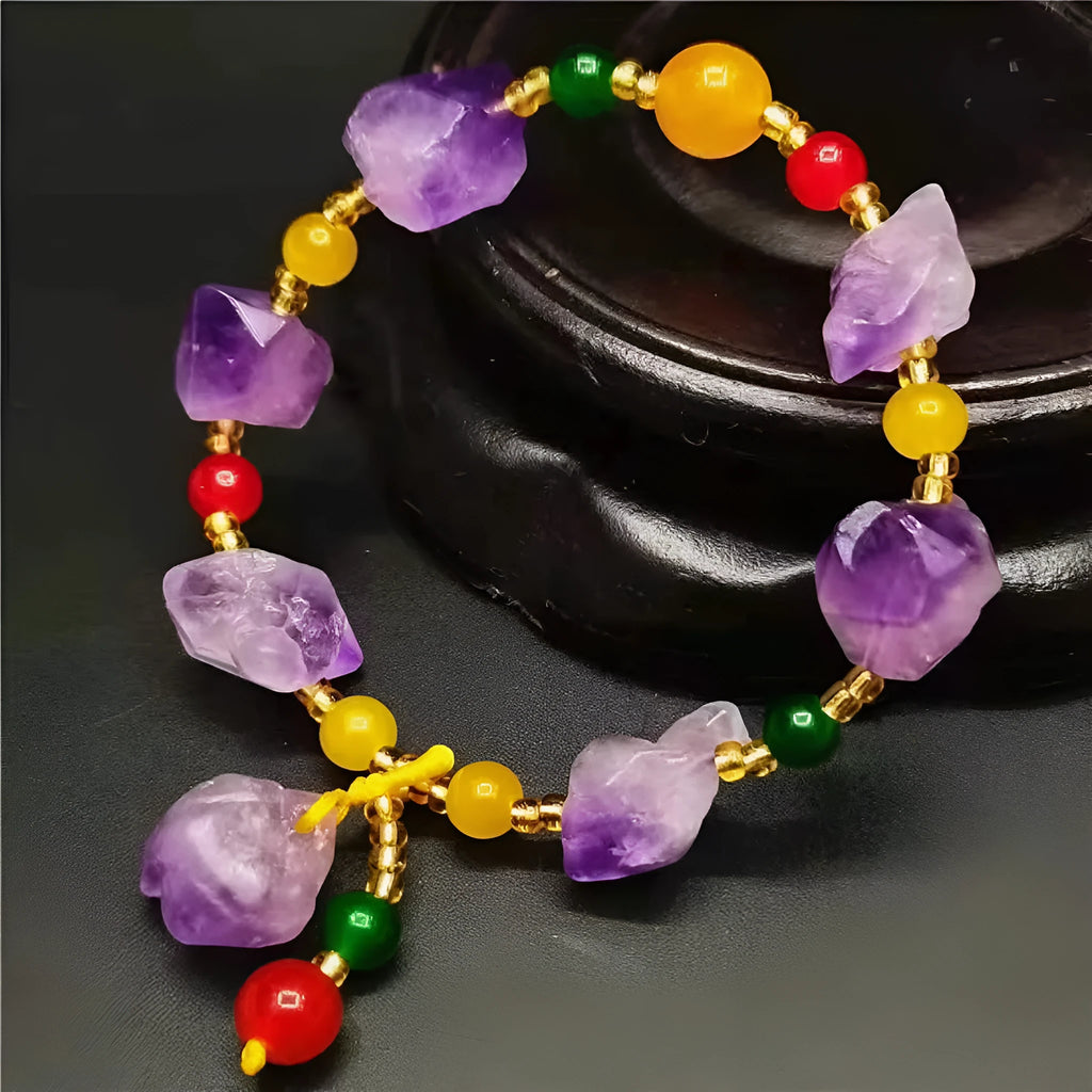 Natural shaped amethyst bead bracelet with fu character element on wrist