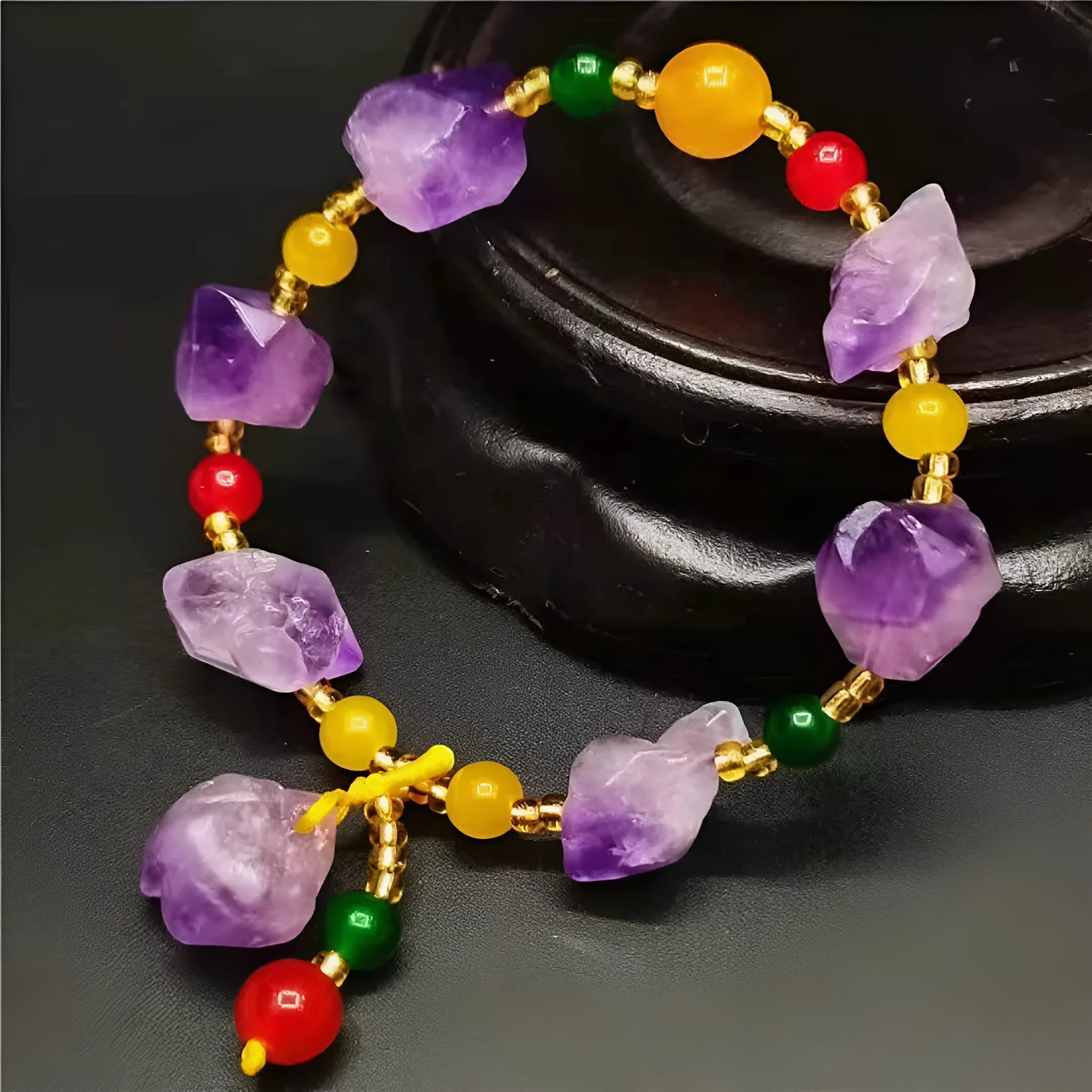 Natural shaped amethyst bead bracelet with fu character element on wrist
