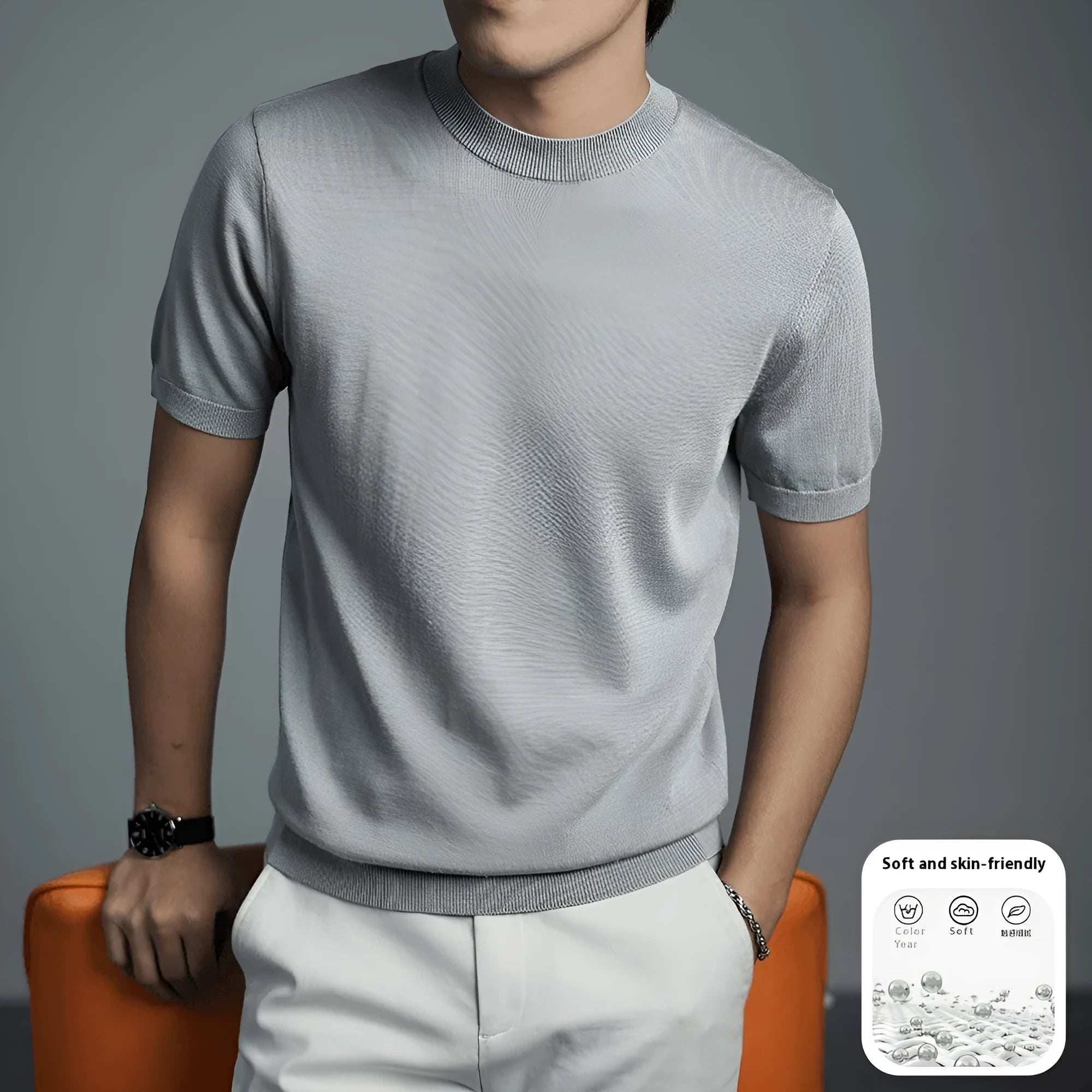 Men's solid colour knitted T-shirt with round neck and short sleeves on a hanger.