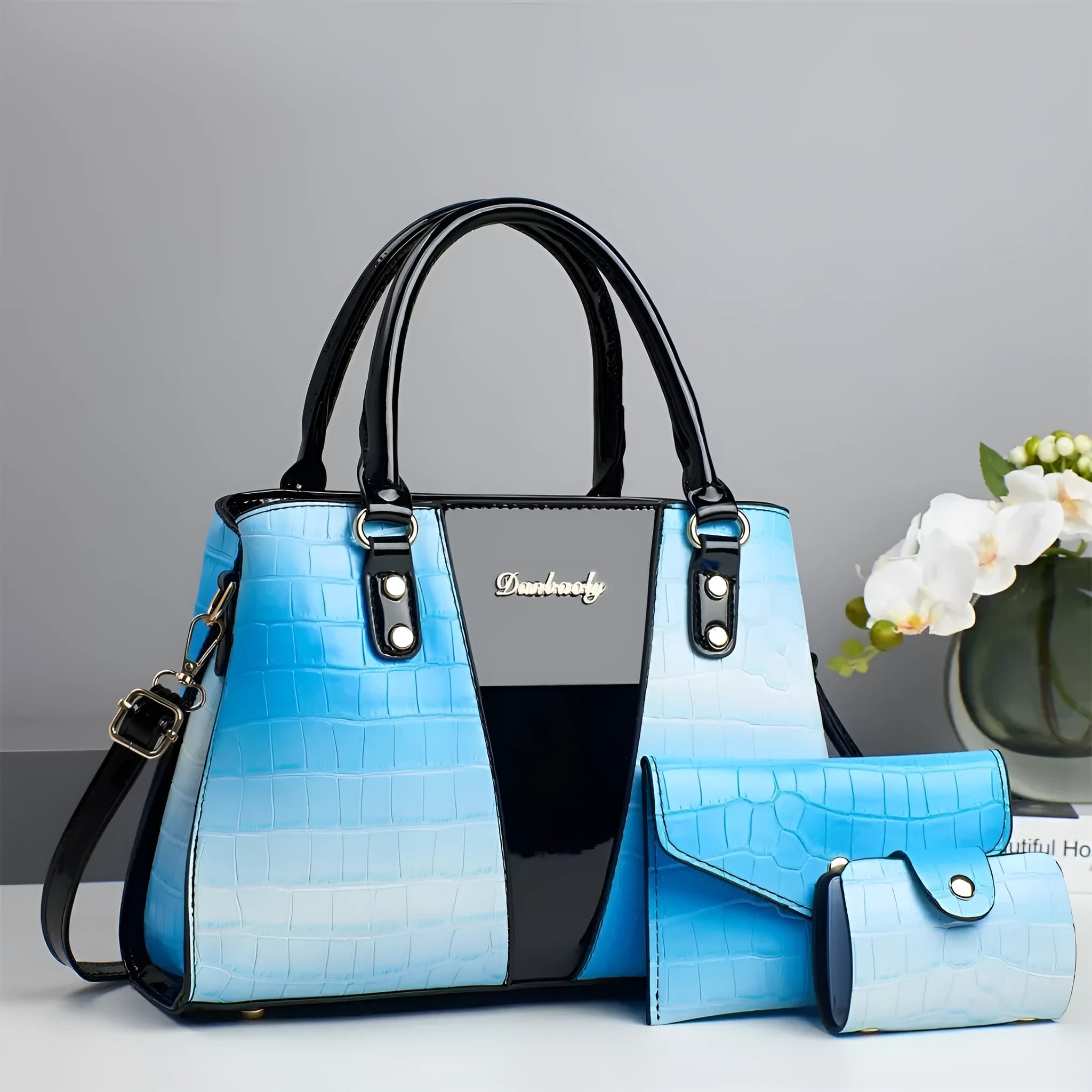 Women's three-piece shoulder bag set with crocodile stitch pattern in PU leather showing main bag and two smaller pouches