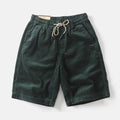 Men's khaki retro cargo shorts with straight leg and pockets on a mannequin.