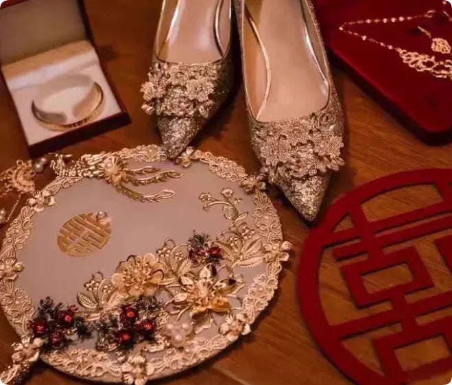 Champagne coloured pointed toe bridal shoes with rhinestone decoration on a fine heel.