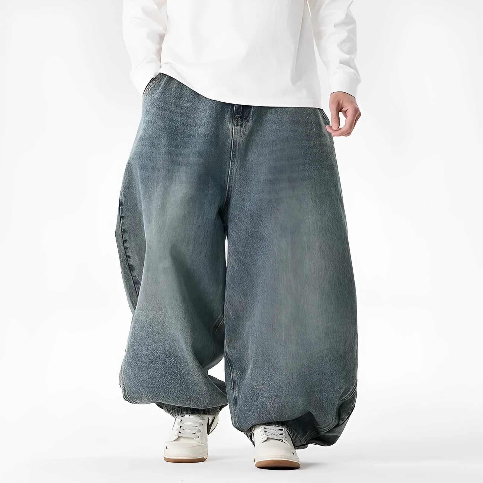 Men's plus size baggy jeans in light blue denim with wide straight legs and a low waist.