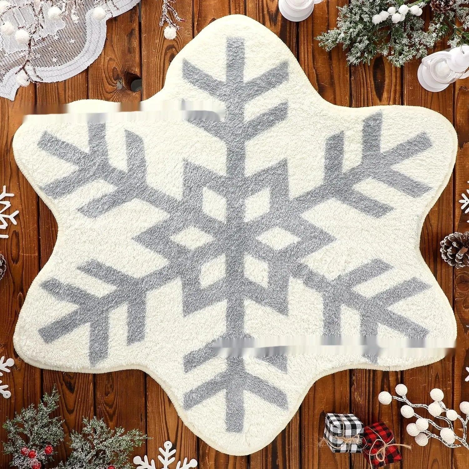 Round Christmas carpet with festive blanket design on floor beside holiday decorations