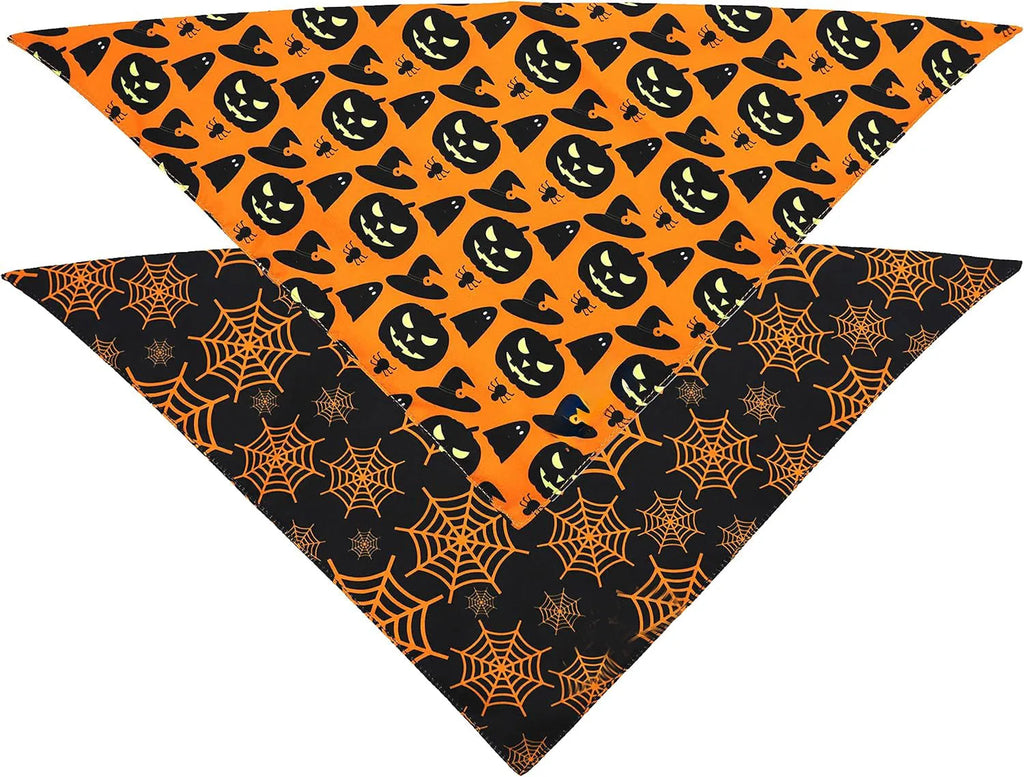 Black and orange reversible Halloween dog bandana with pumpkin and spider web patterns, showing adjustable neck strap.