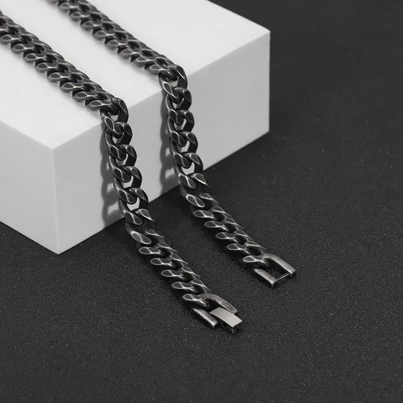 Silver titanium steel geometric bracelet with 10mm width on a neutral background