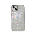 White TPU phone case with fantasy shell pattern compatible with iPhone 13 showing back design and side buttons
