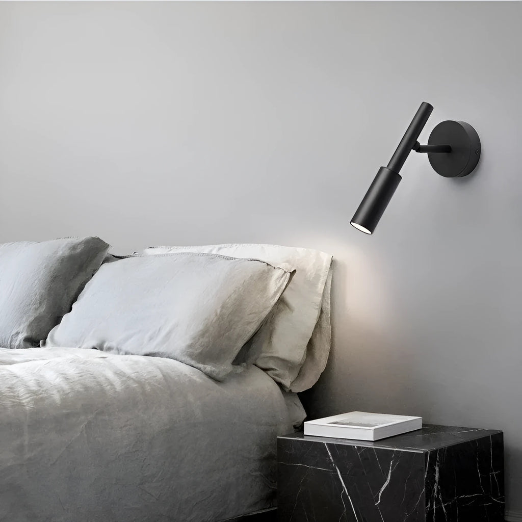 Modern wrought iron wall lamp in black or white finish, showing three colour light options.