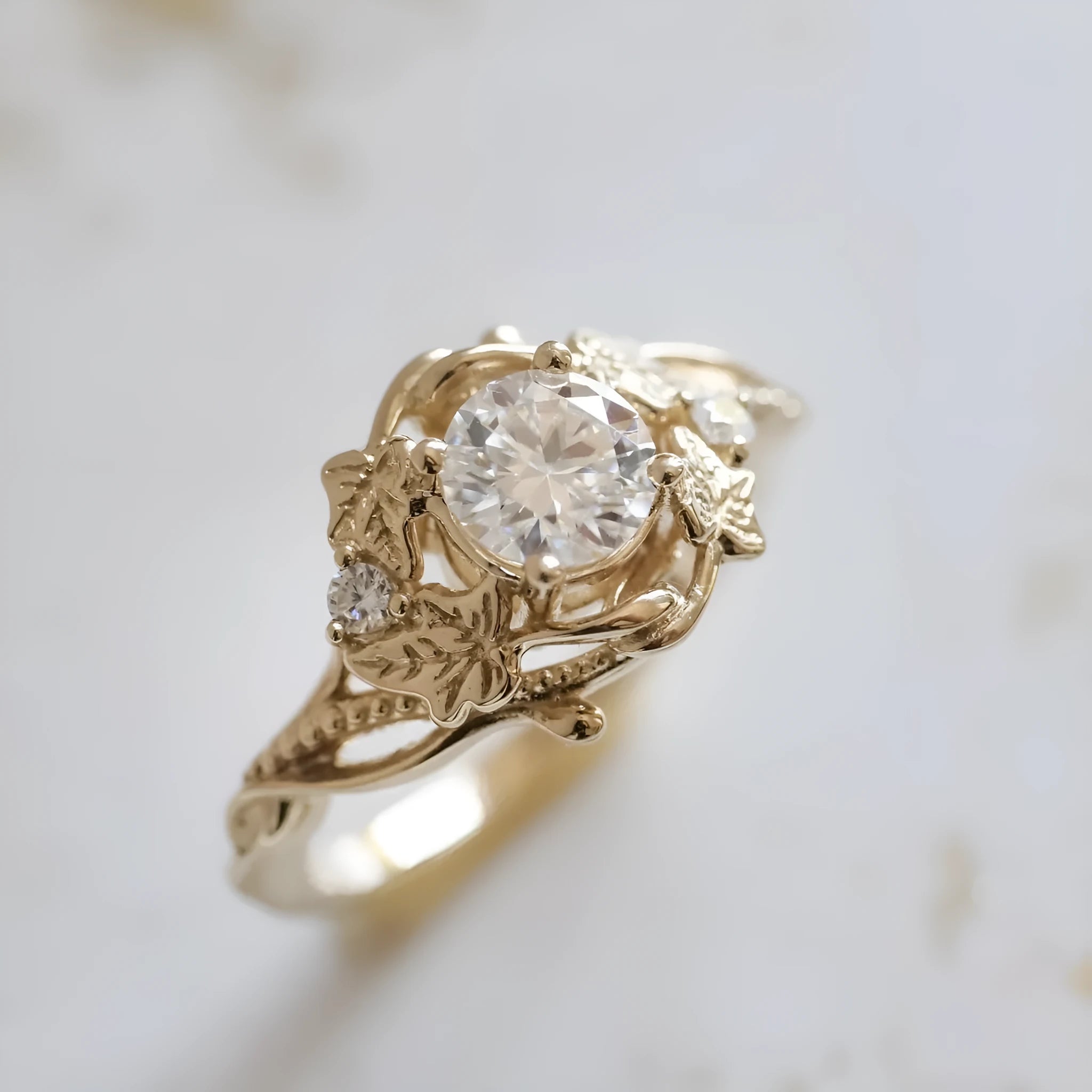 Gold alloy ring with brushed finish on neutral background