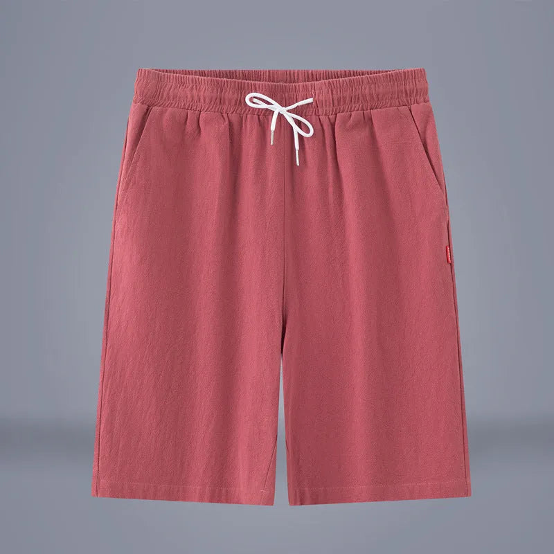 A pair of solid colour cotton linen cropped pants with a drawstring waist, shown in Army Green.