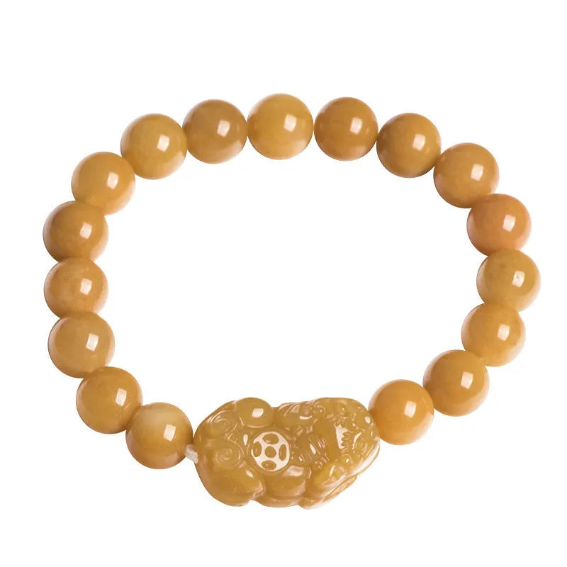 Hand-carved Jinsi Jade money bracelet showing golden thread patterns with jade beads