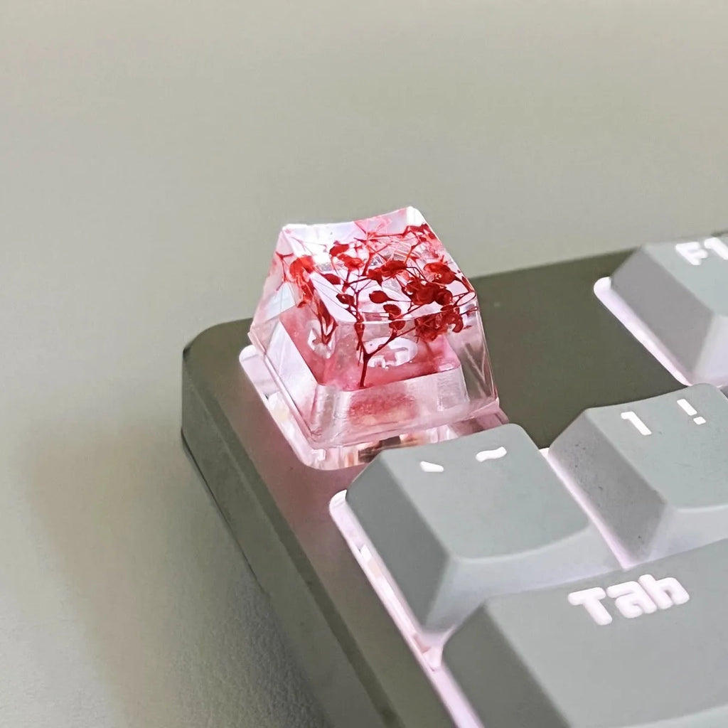 High transparency resin mechanical keyboard keycap with starry sky design in one of four colours.