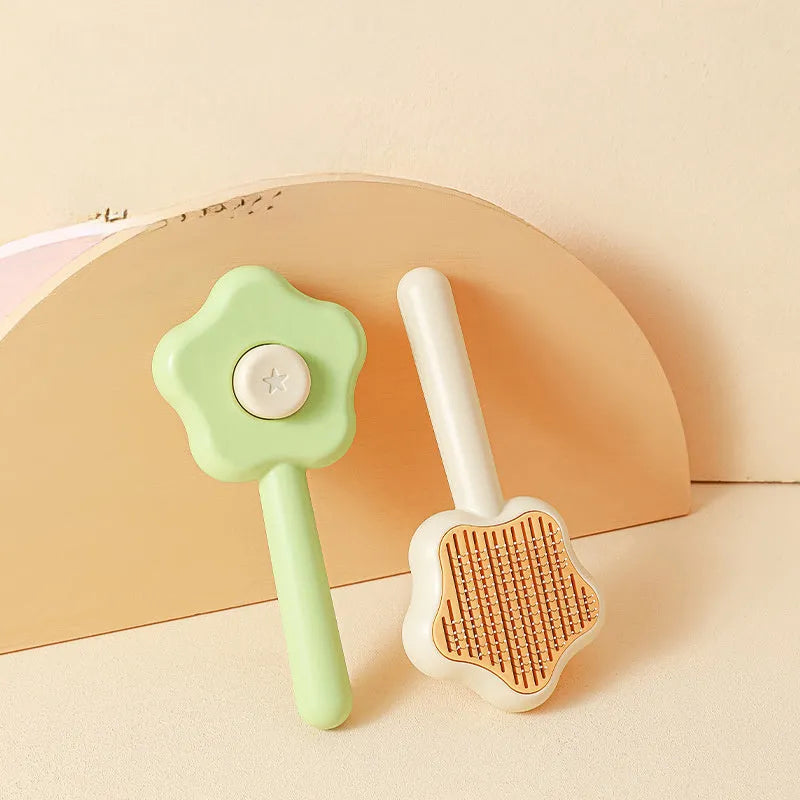 Self-cleaning stainless steel needle cat comb with magic wand handle in green or yellow