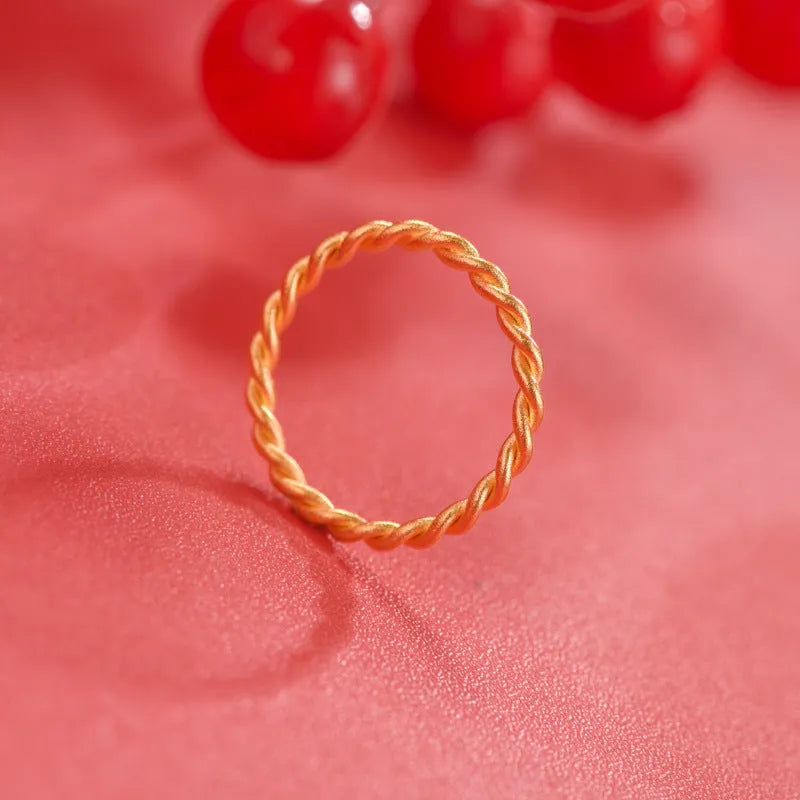 A brass gold plated women's ring in a simple bracelet design, shown in glossy, matte, and twist style variations.