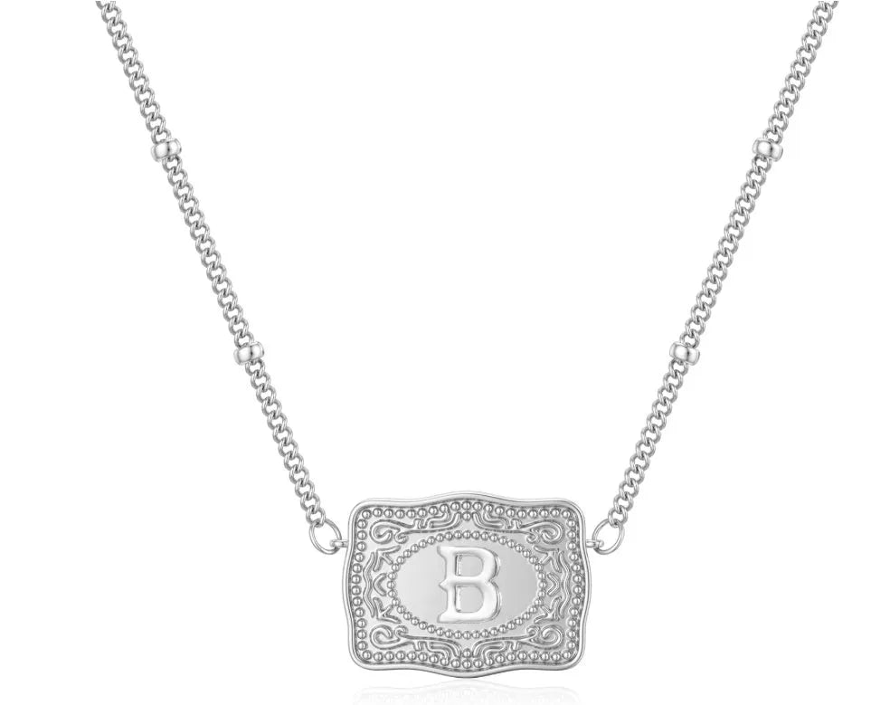 Copper letter necklace showing gold and white K electroplated finishes with alphabet charms