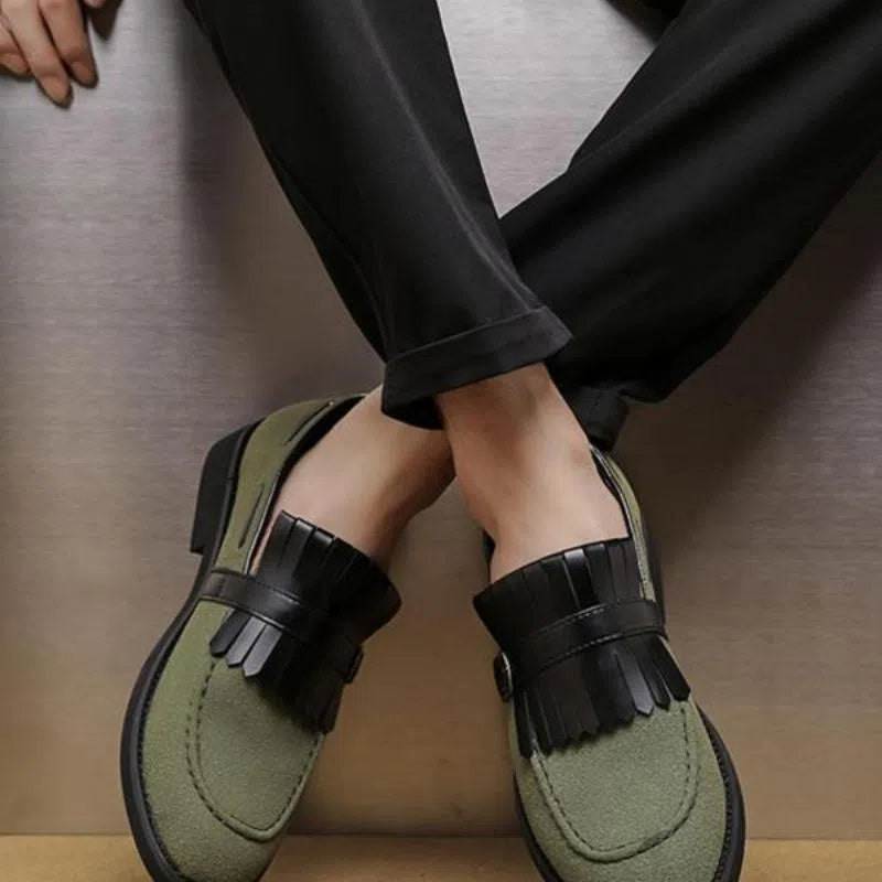 Men's gray denim loafer shoes with tassel accents, pointed toe, flat heel, on a white background