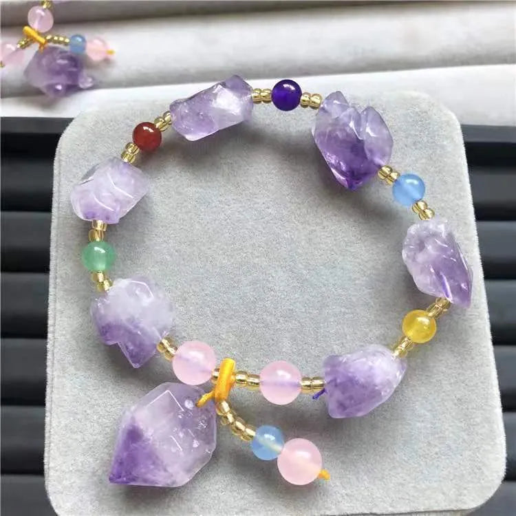 Natural shaped amethyst bead bracelet with fu character element on wrist