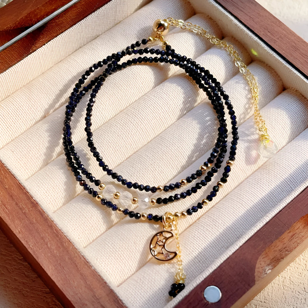 Women's three-ring layered bracelet with blue sand stone beads and gold-toned metal components