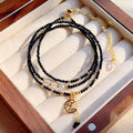 Women's three-ring layered bracelet with blue sand stone beads and gold-toned metal components