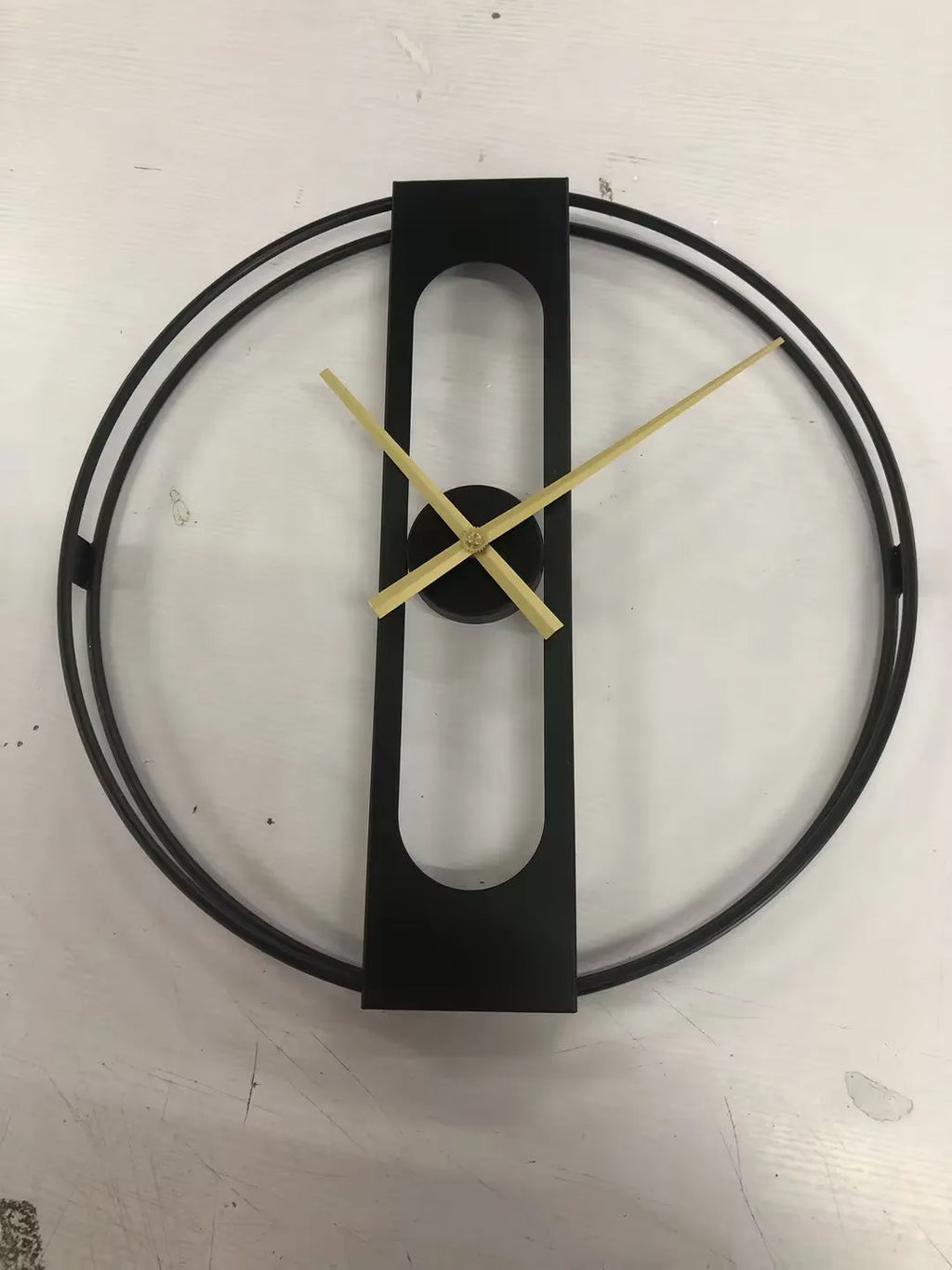 50cm round metal wall clock in black or gold colour with battery-powered movement