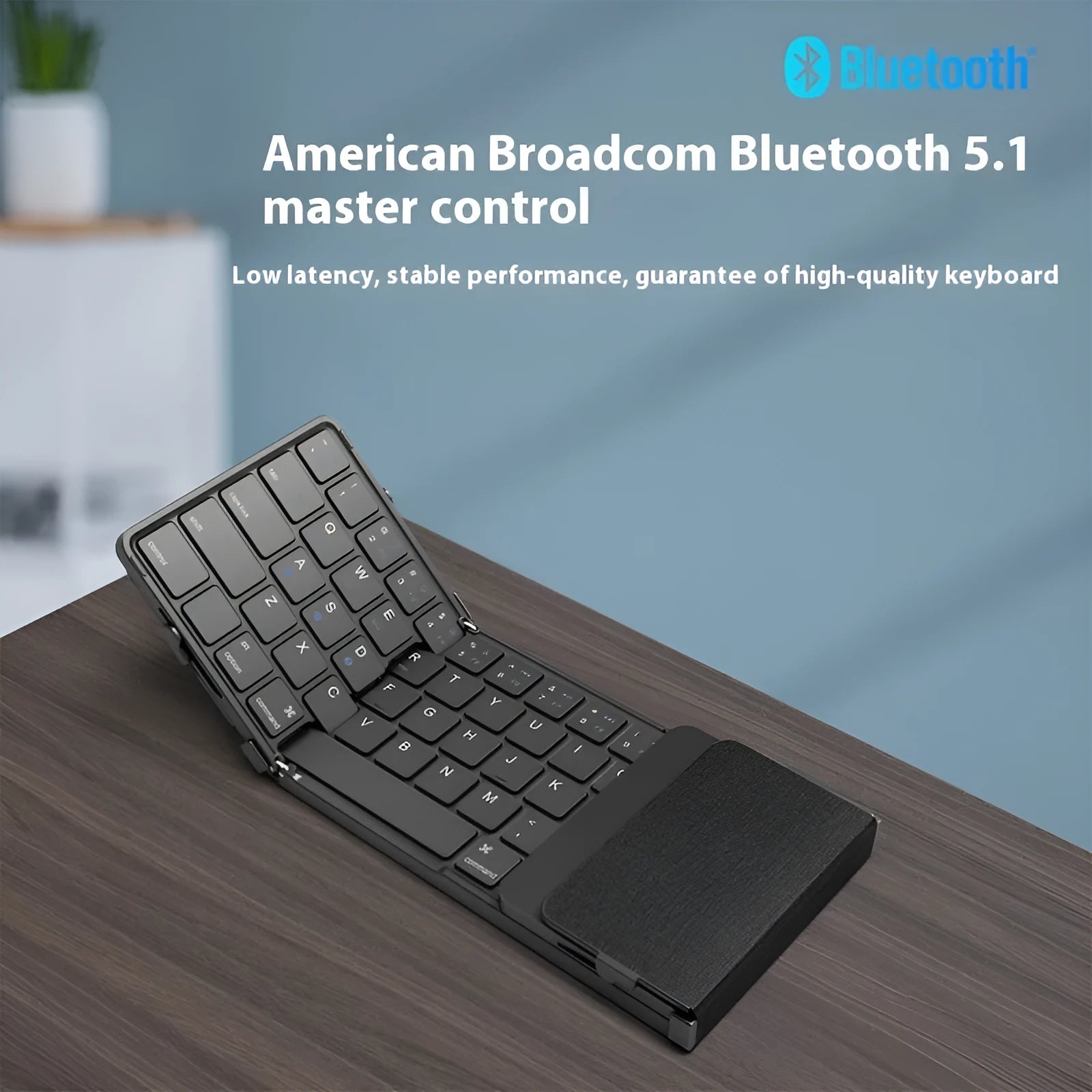 Black folding Bluetooth keyboard for mobile phones and tablets showing touchpad version