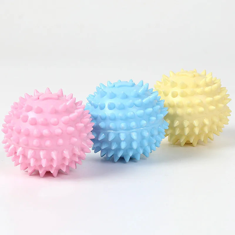 Blue TPR dog chew ball with footprint pattern and raised texture for dental cleaning