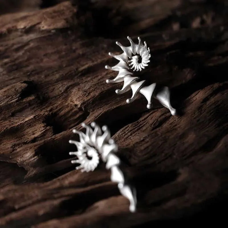 Matte finished conch stud earrings with three-dimensional alloy design
