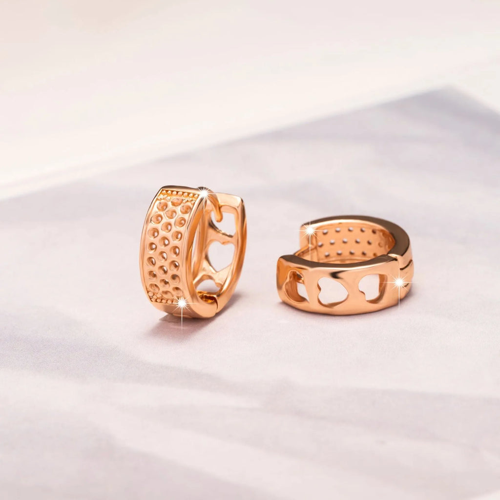 Rose gold hollowed-out heart-shaped earrings with three-layer openwork design