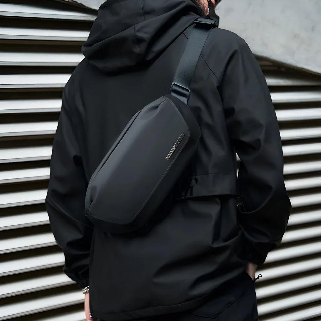 Black Oxford cloth men's messenger crossbody bag with visible stitching.
