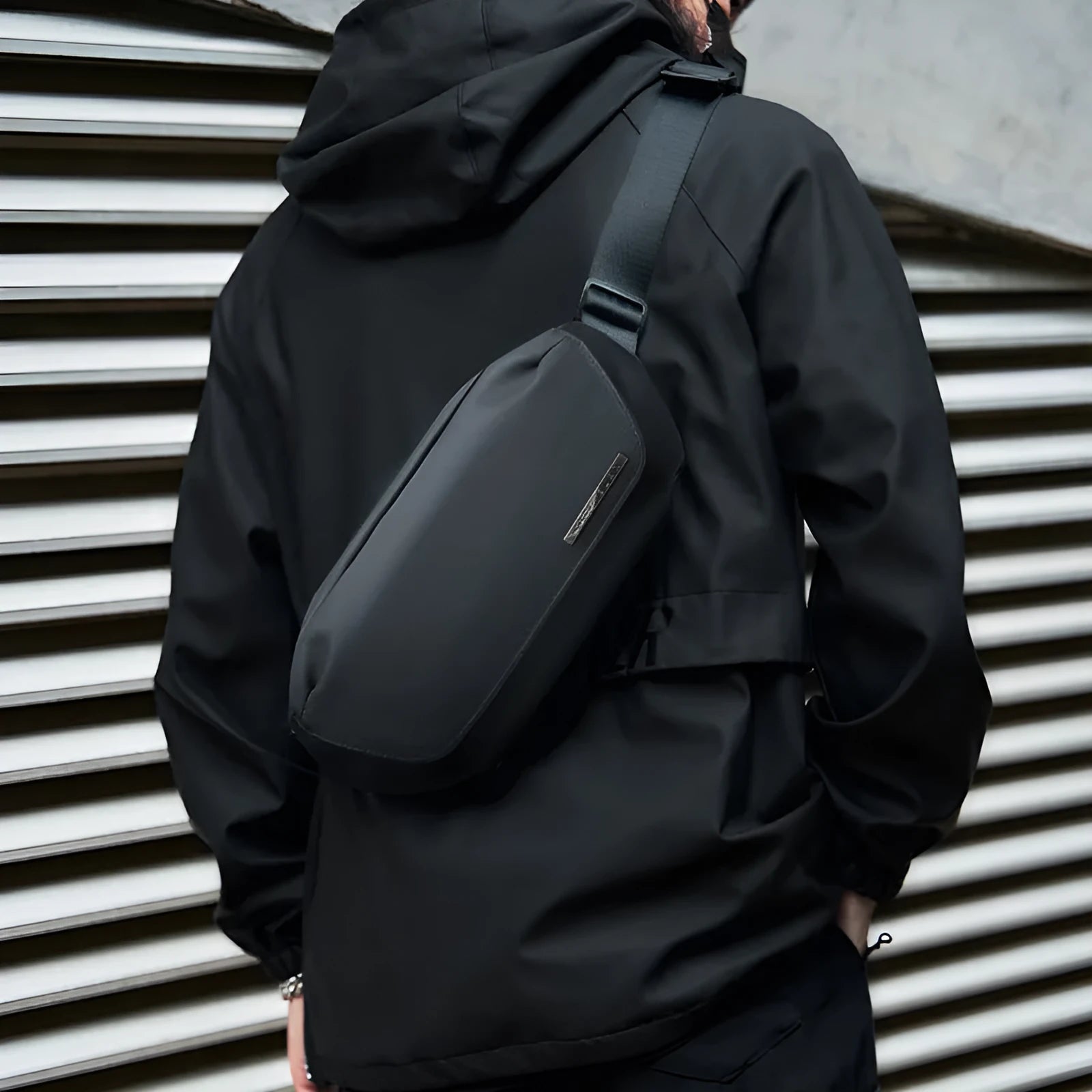 Black Oxford cloth men's messenger crossbody bag with visible stitching.