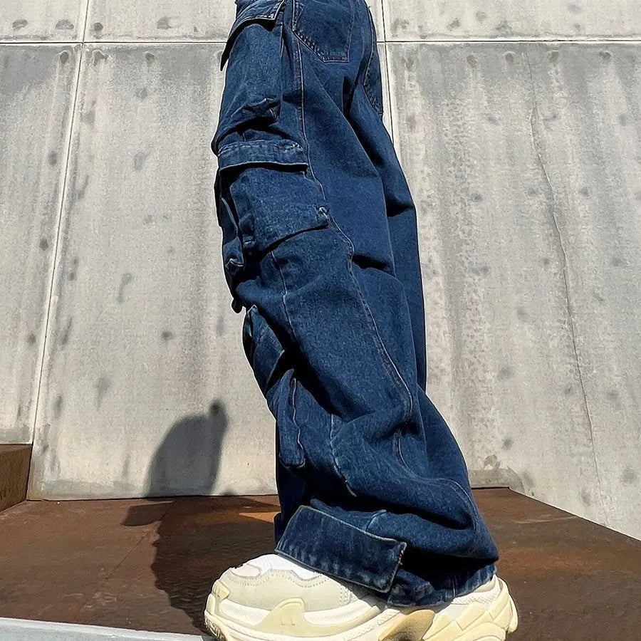 Dark blue distressed women's wide-leg jeans with a high waist and multiple pockets on a mannequin.