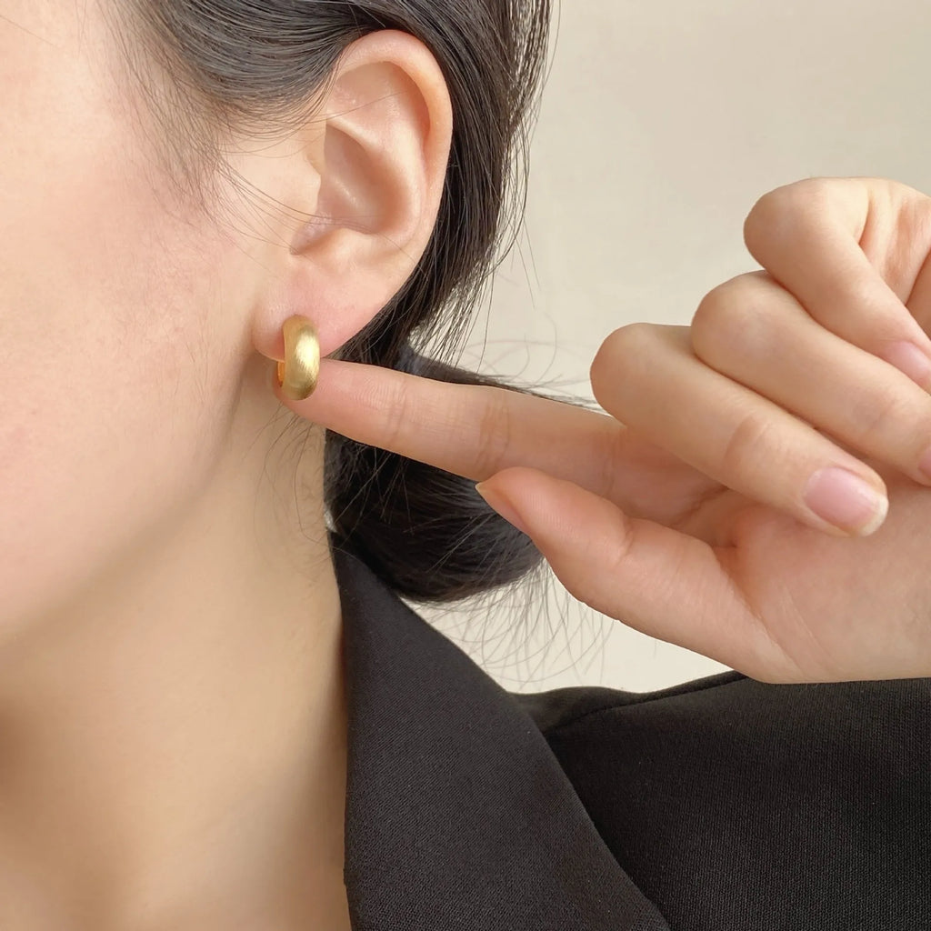 Geometric C-shaped brushed copper earrings with frosted finish available in gold or silver for women
