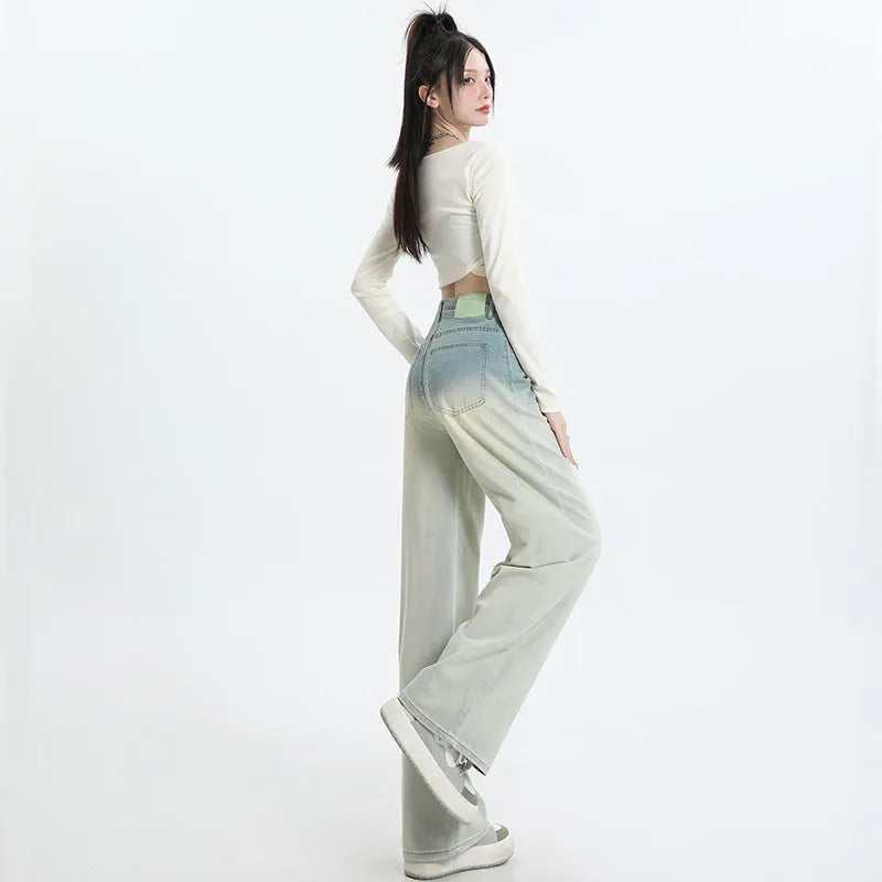 Women's gradient blue cotton denim wide-leg straight trousers on a hanger.