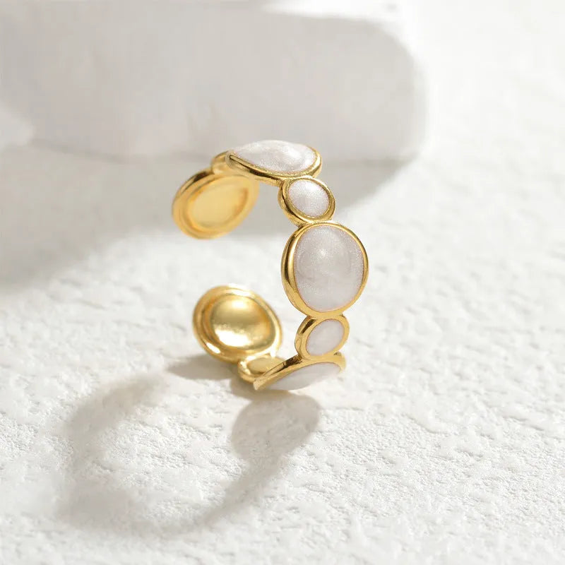 Stainless steel geometric ring with adjustable opening and electroplated metallic finish