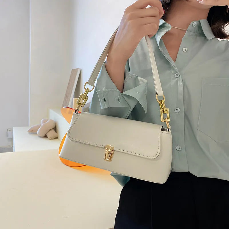Brown PU leather underarm shoulder bag with square shape, sandwich pocket front and adjustable shoulder chain