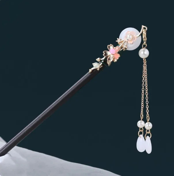 Chinese ancient style floral alloy hairpin with electroplated finish on dark background