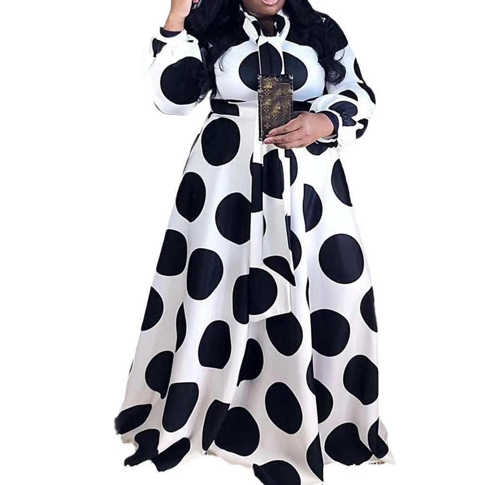 Women's large size white polka dot dress with long sleeves and long skirt, shown in white with white dots