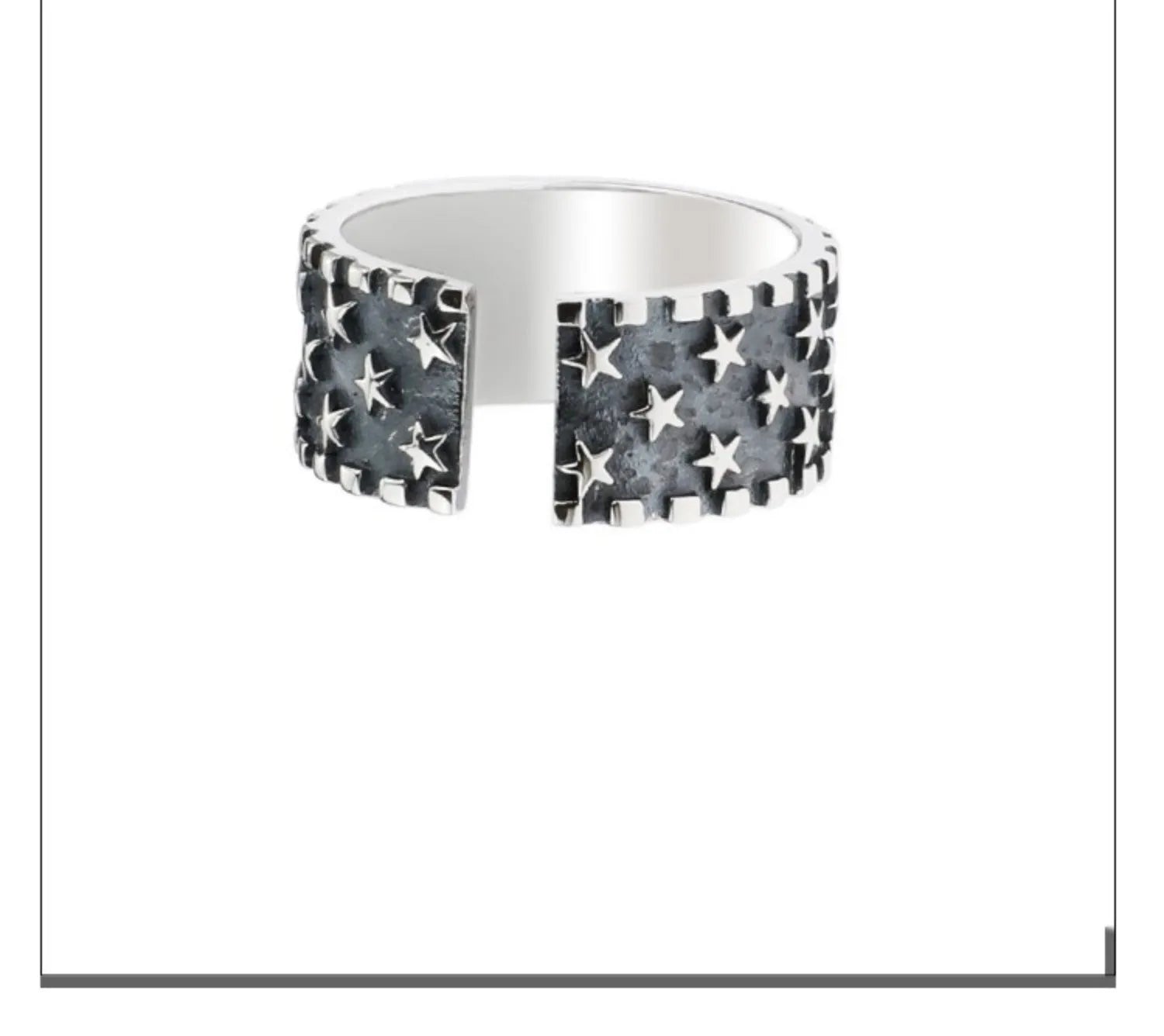 Adjustable sterling silver ring featuring a raised five-pointed star geometric pattern on the band.