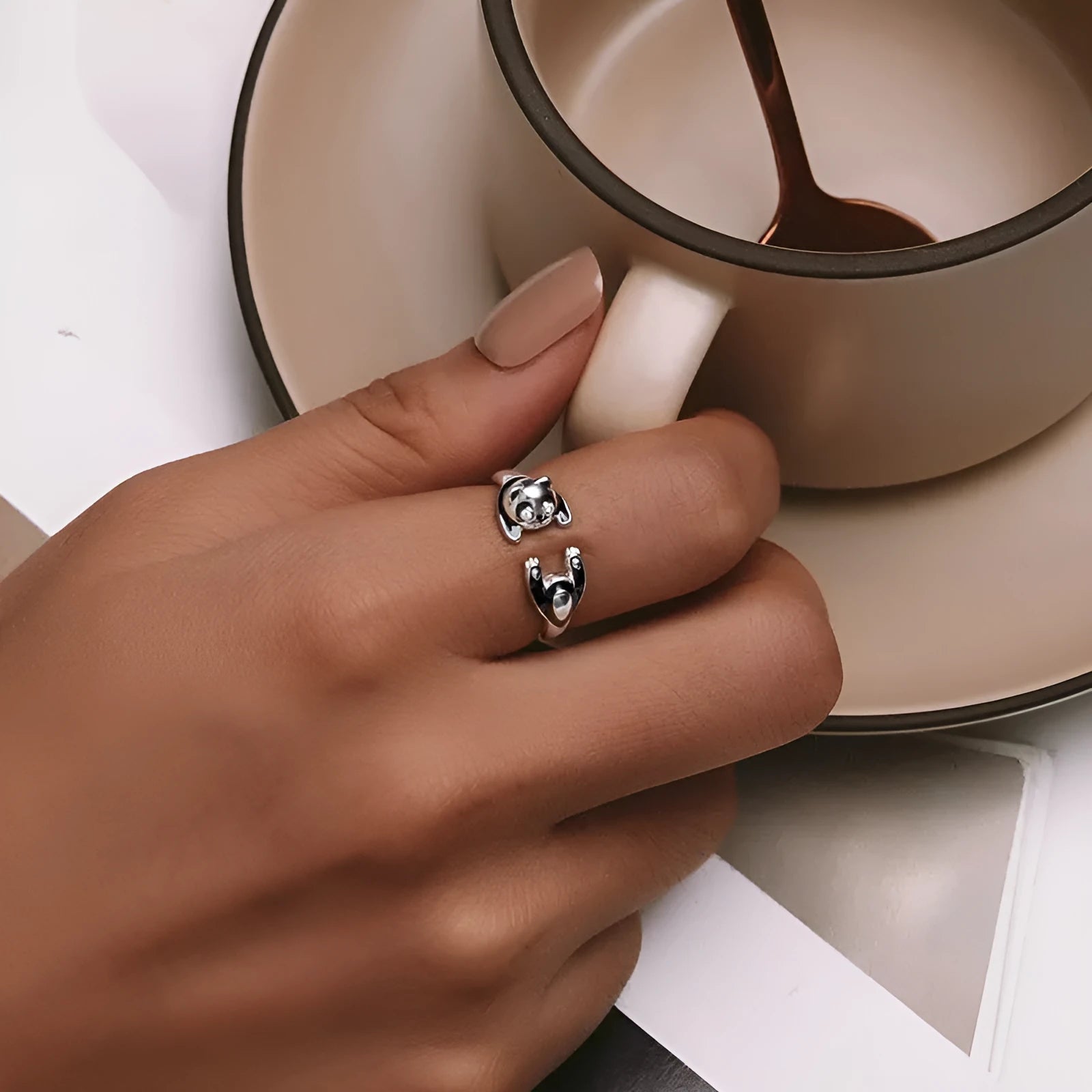 Sterling silver adjustable panda ring with white gold plating showing open bracelet design