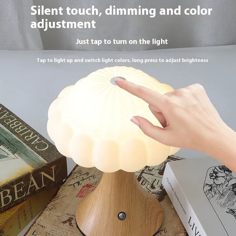Wood grain finish mushroom-shaped touch night lamp on a table