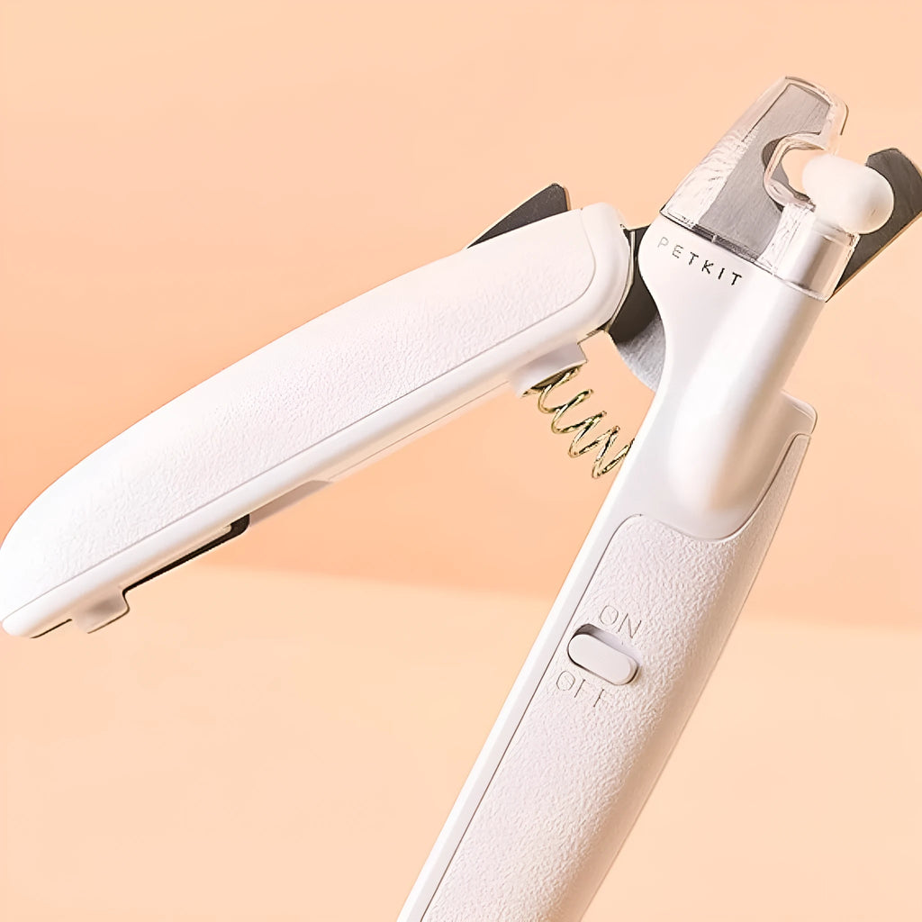 White pet nail clippers with LED light, anti-splash transparent guard, and a leather-like handle on a blue background.